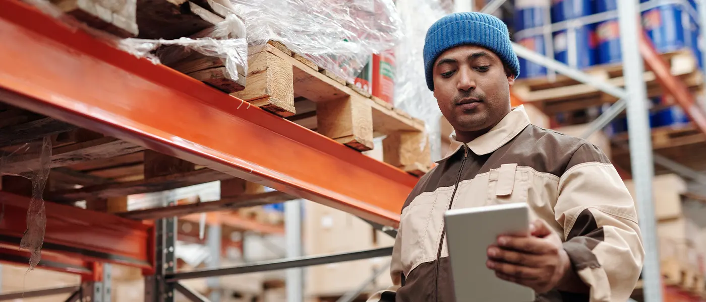 Streamline Your E-commerce Operations in Malaysia with Locad’s Inventory Management Service 47 E-commerce warehouse representative looking at last mile delivery checklist | Locad