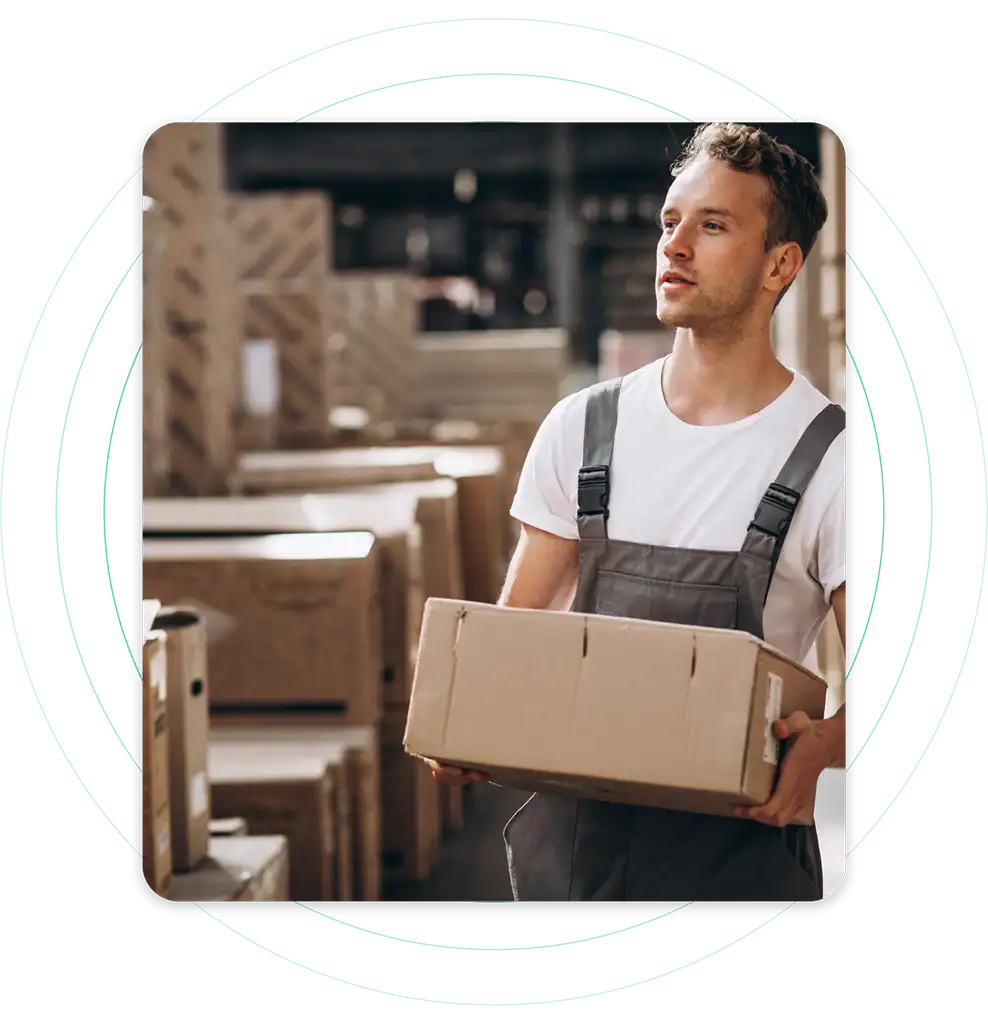Inbound Vs Outbound Logistics: What’s the Main Difference? 1 a warehouse employee moving inventory items and boxes