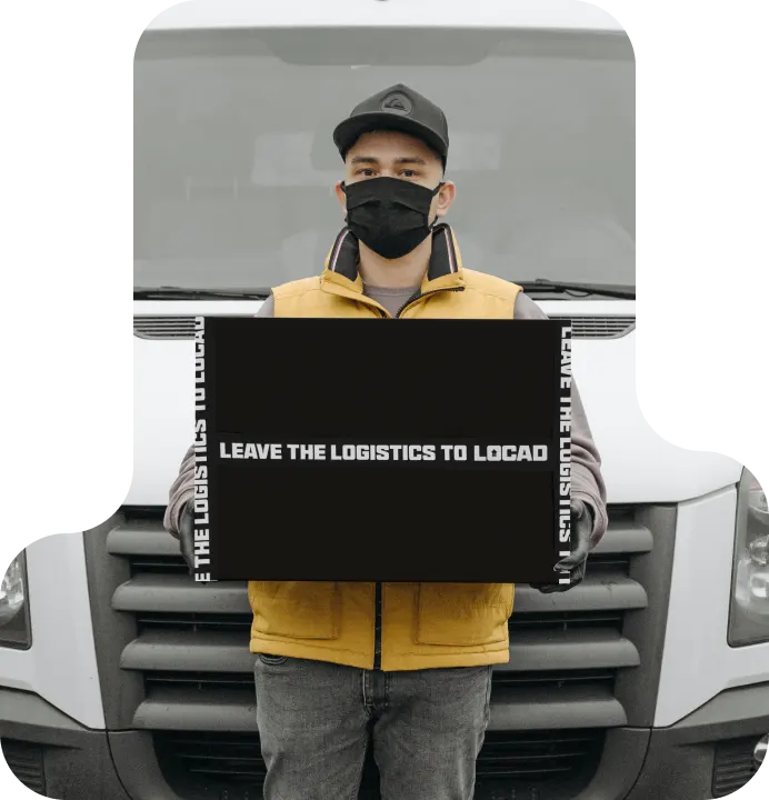 Locad – Thailand 7 3PL delivery guy holding a box in front of van