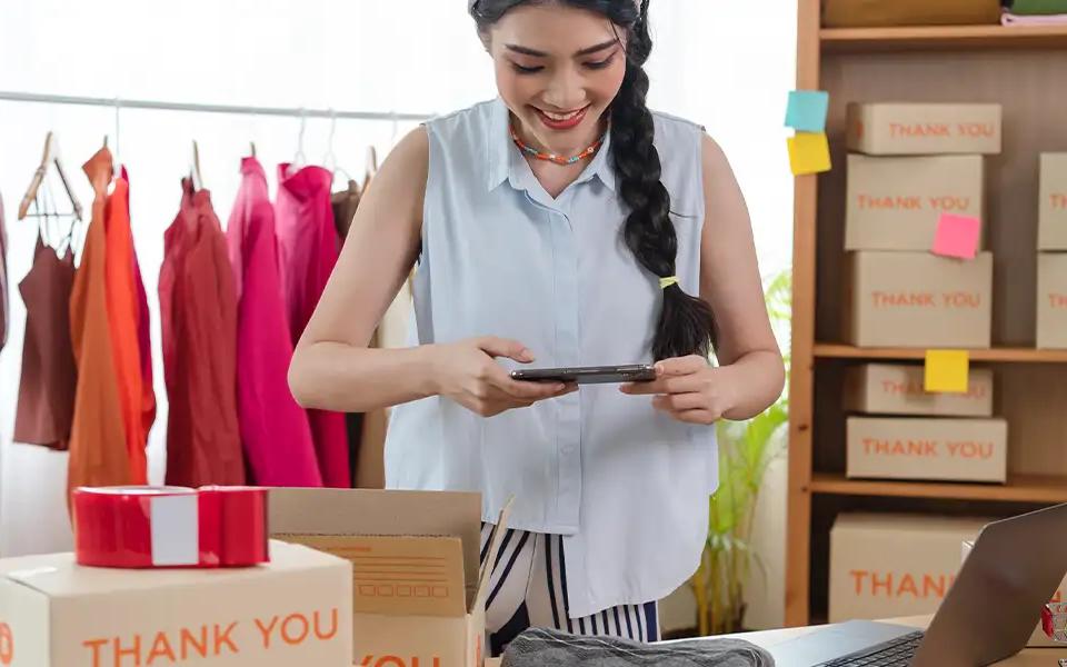 E-commerce business owners logging order details for sales | Locad